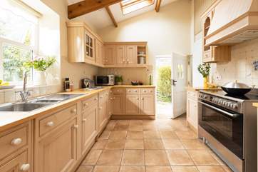 The fabulous kitchen has a superb range cooker and much more allowing you to whip up a family feast. The stable-door leads out on to the courtyard with the garden being accessed via a gate.