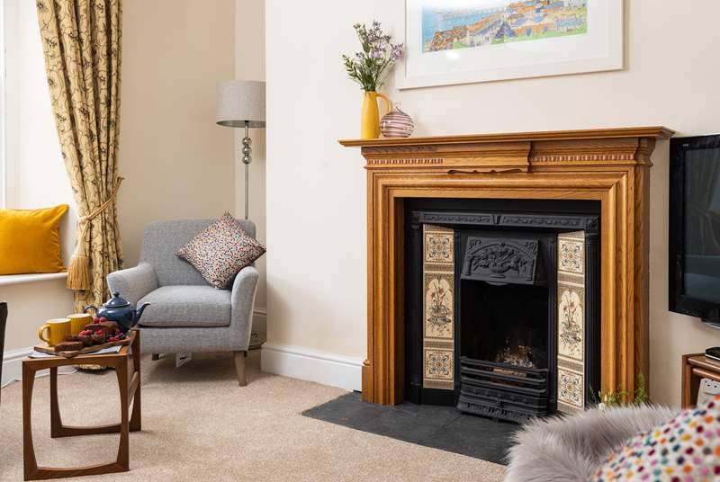 The sitting-room has an attractive open fire, a lovely focal point.