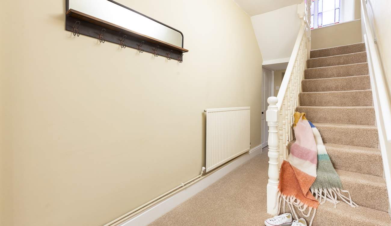 The staircase leads to the four bedrooms and family bathroom on the first floor. 