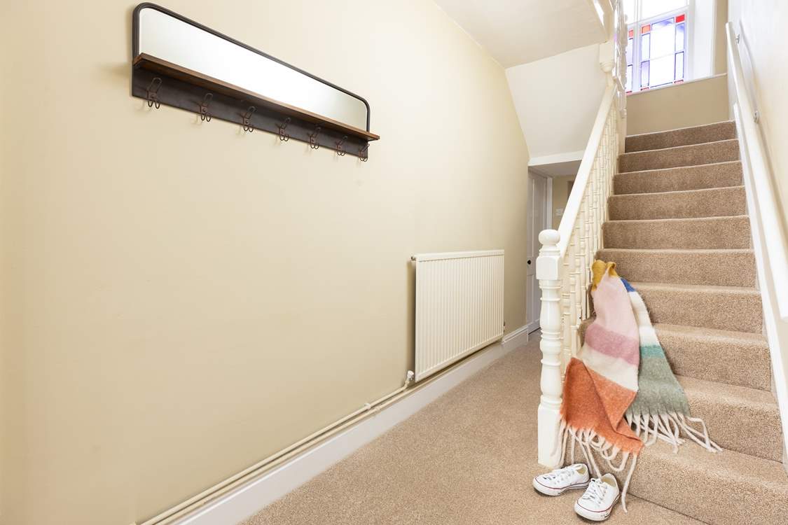 The staircase leads to the four bedrooms and family bathroom on the first floor.