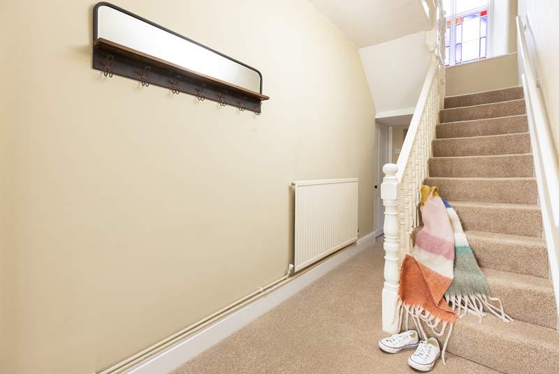The staircase leads to the four bedrooms and family bathroom on the first floor. 