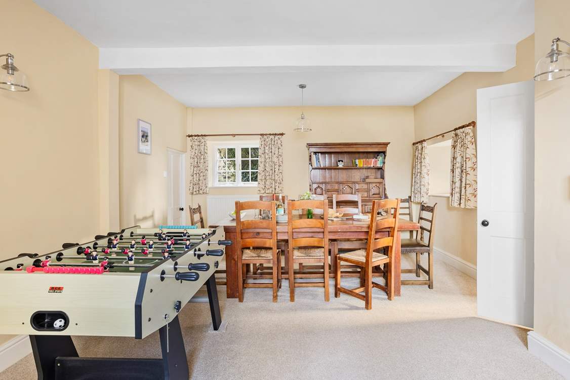 Gather everyone around the table for a leisurely supper or glass of wine, the kitchen can be found through the door.