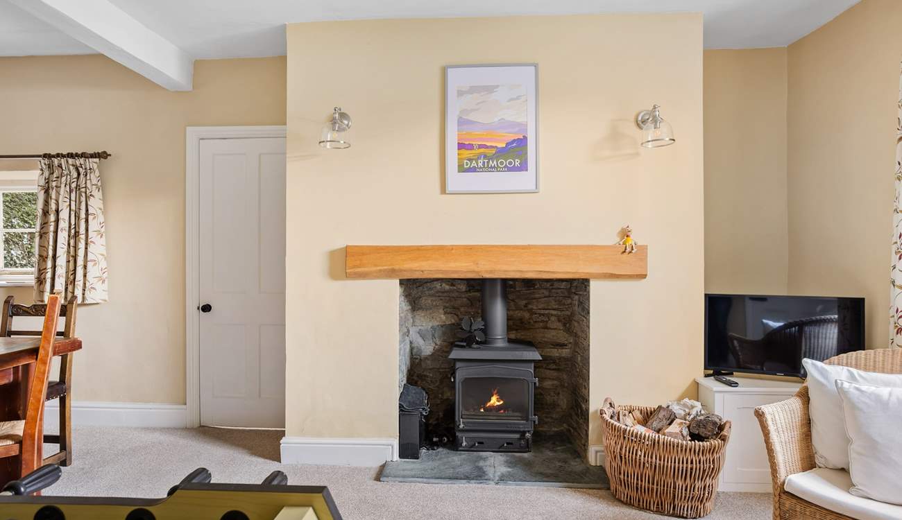 The dining-room is always cosy and warm thanks to the log-burner.