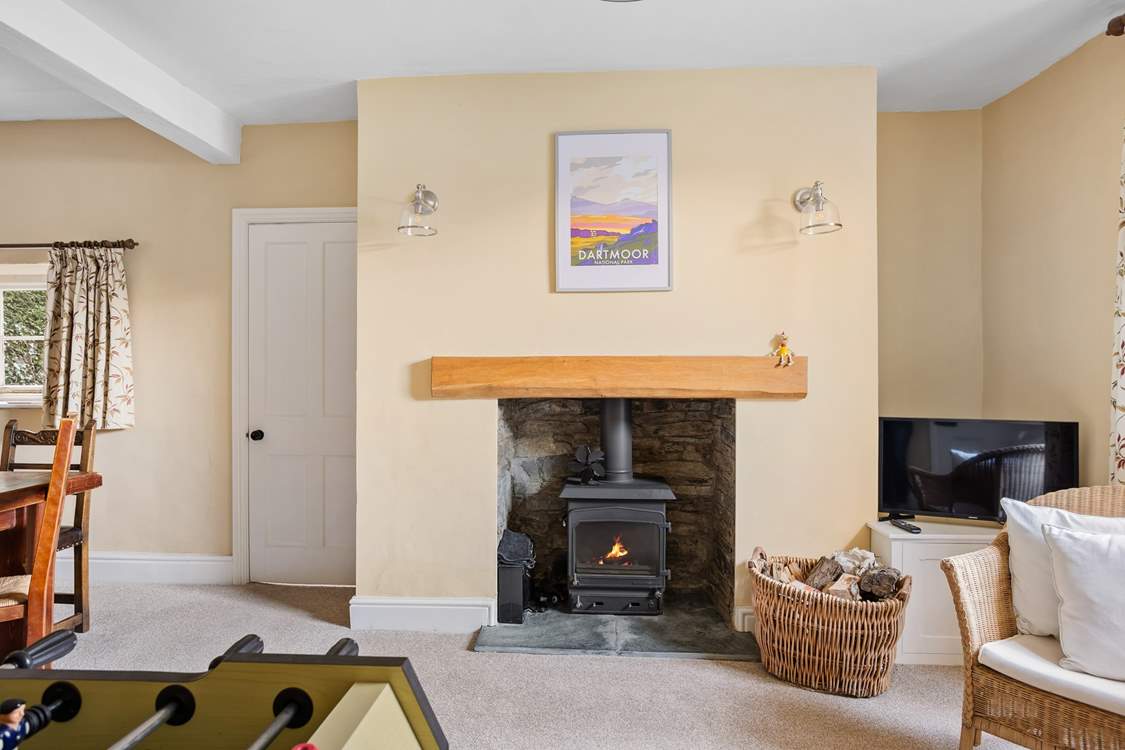 The dining-room is always cosy and warm thanks to the log-burner.