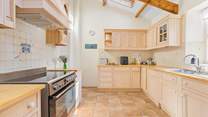 The fabulous kitchen has a superb range cooker and much more allowing you to whip up a family feast.  From the kitchen you step down into the dining/games-room. The garden can also be accessed from the kitchen.