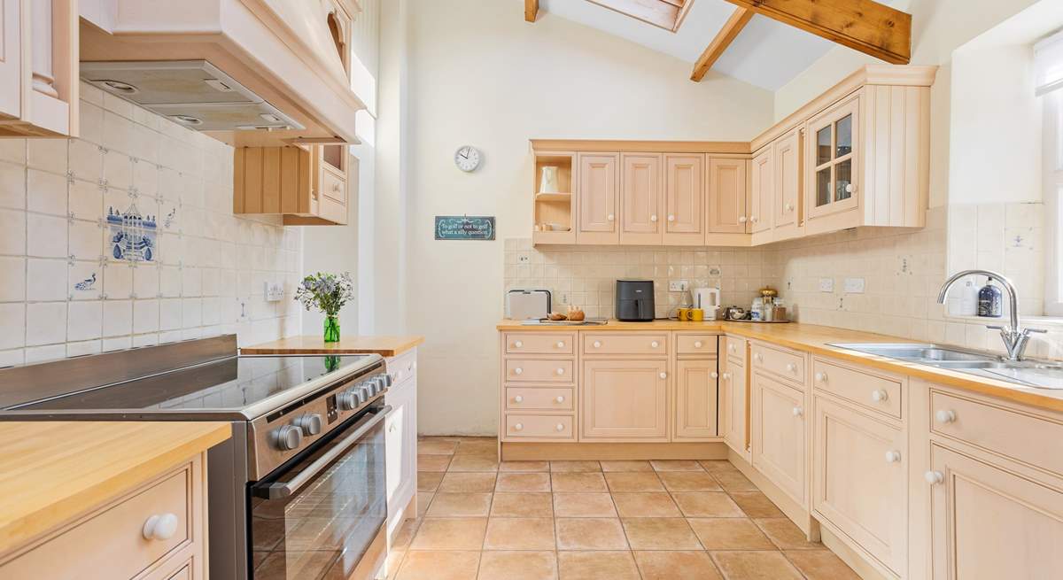 The fabulous kitchen has a superb range cooker and much more allowing you to whip up a family feast.  From the kitchen you step down into the dining/games-room. The garden can also be accessed from the kitchen.