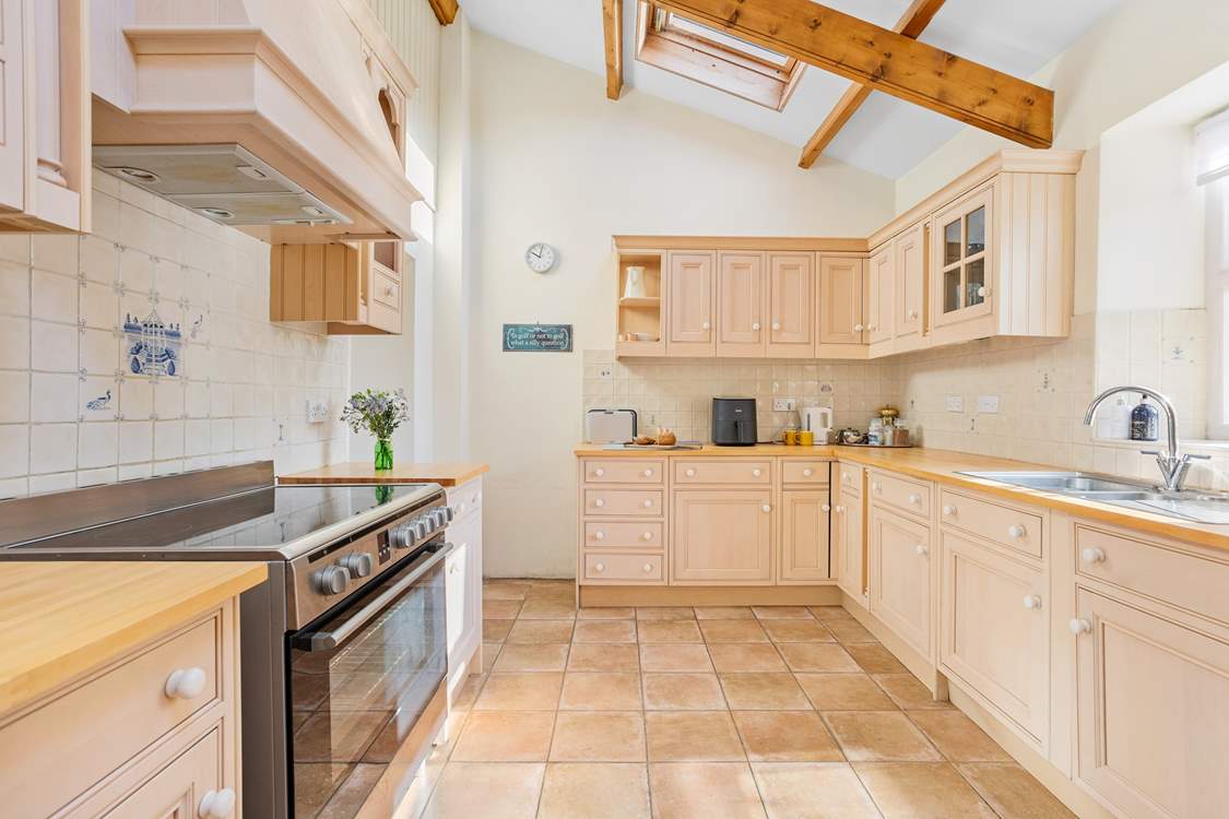 The fabulous kitchen has a superb range cooker and much more allowing you to whip up a family feast. From the kitchen you step down into the dining/games-room. The garden can also be accessed from the kitchen.