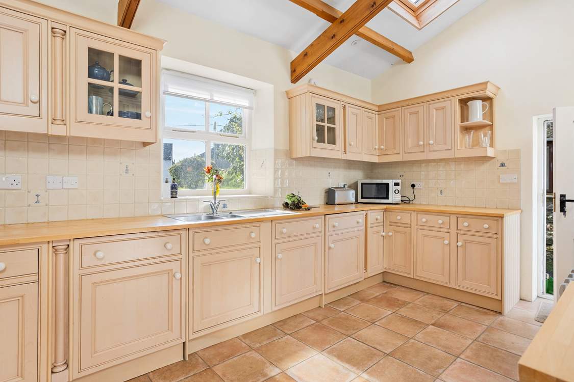 The kitchen is light and bright with a lovely view from the kitchen window out to the garden.