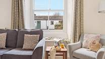 Head to the sitting-room and relax into one of the two plump sofas or take a window pew looking out over the courtyard. 