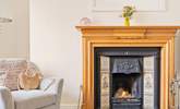 The sitting-room has an attractive open fire, a lovely focal point. - Thumbnail Image