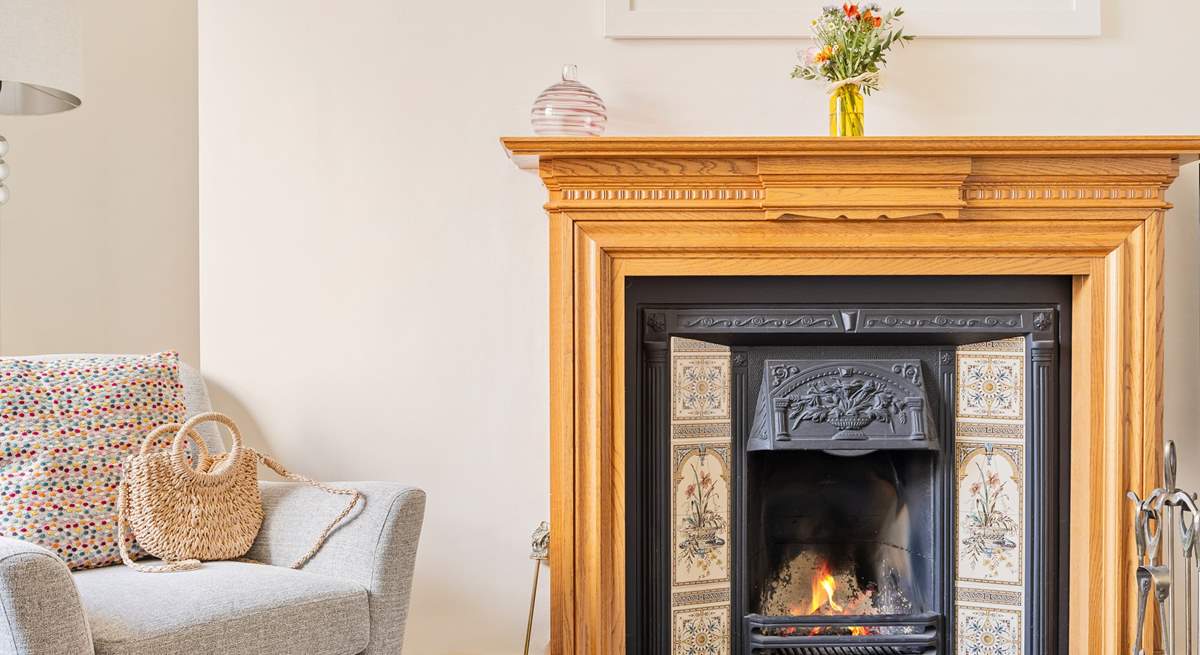 The sitting-room has an attractive open fire, a lovely focal point.