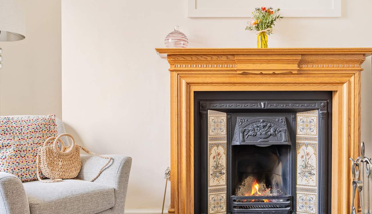 The sitting-room has an attractive open fire, a lovely focal point.