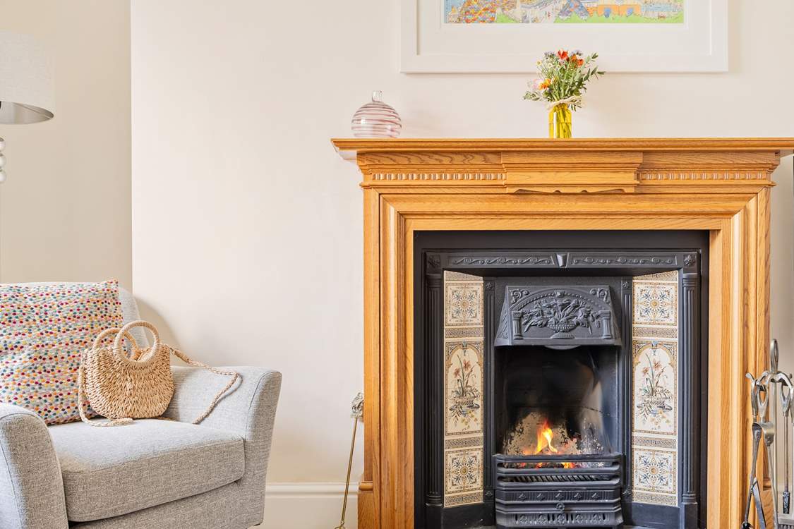 The sitting-room has an attractive open fire, a lovely focal point.