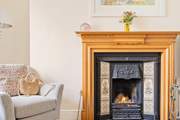 The sitting-room has an attractive open fire, a lovely focal point.
