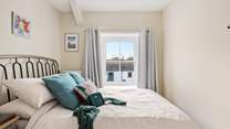 Pretty bedroom three has a double bed. 