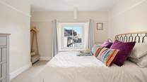 Gorgeous bedroom four has a king-size double bed and an en suite shower-room.