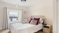 Bedroom four has lovely furnishings and bed linens; this is a room you can retreat to!