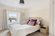 Bedroom four has lovely furnishings and bed linens; this is a room you can retreat to!