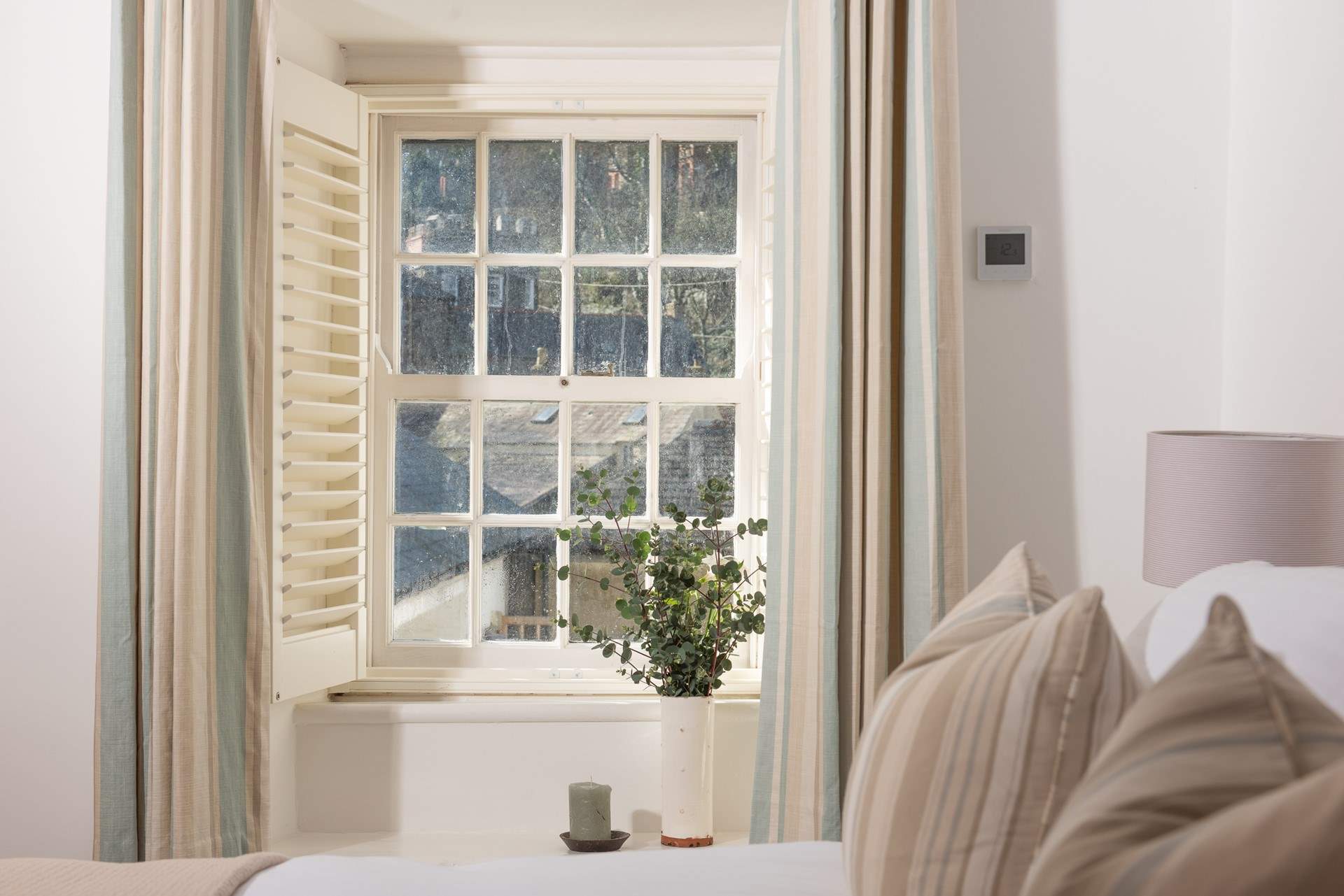 Full of character with wooden shutters and a little window seat.