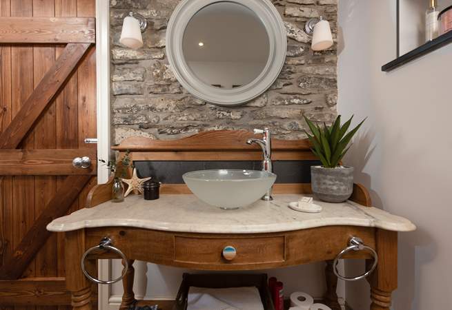A beautiful washstand with a modern sink in the bathroom.
