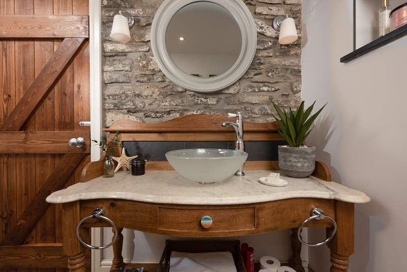 A beautiful washstand with a modern sink in the bathroom.