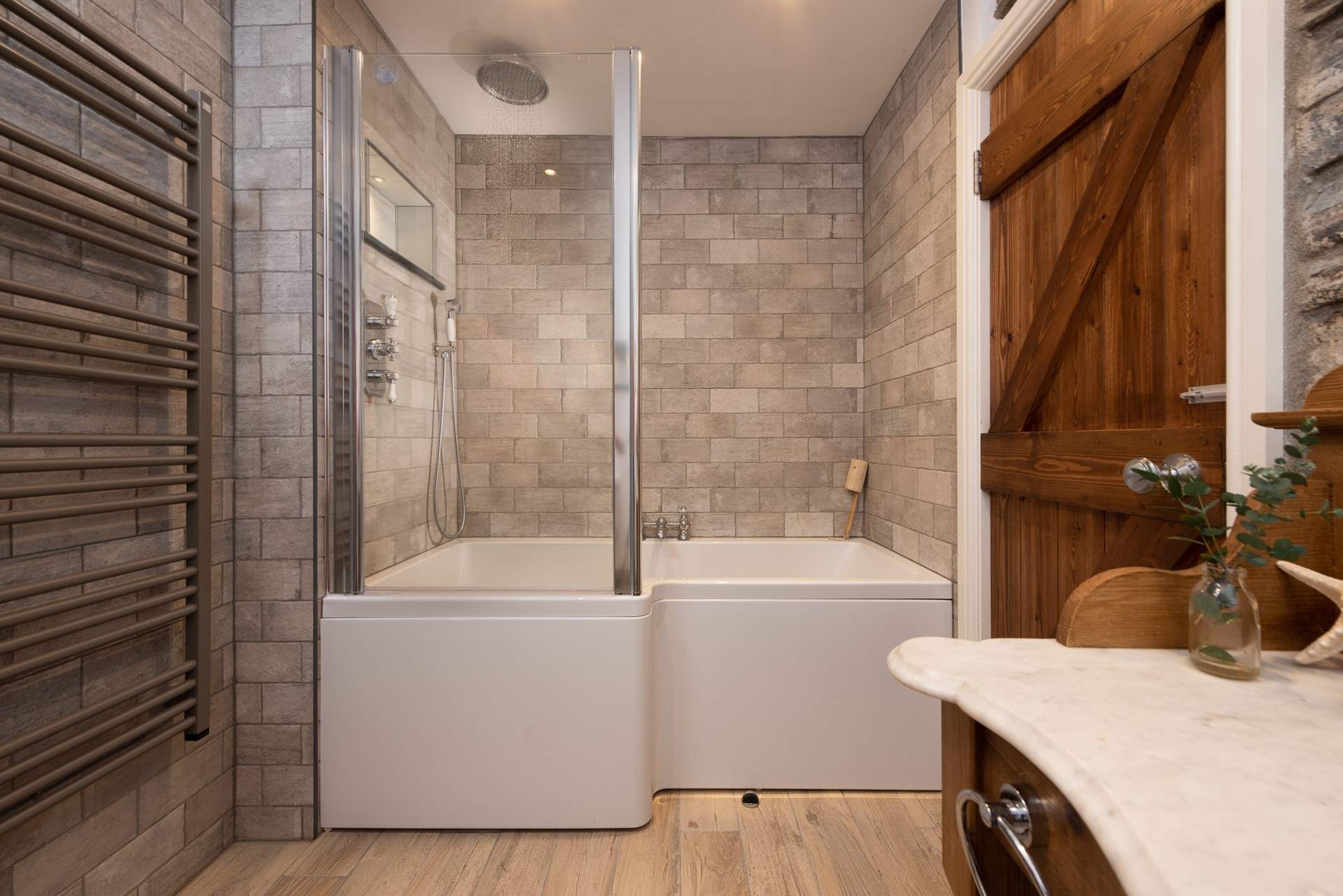 The cottage bathroom is on the ground floor, complete with bath and overhead shower - perfect for long soaks or quick wake-me-up showers in the morning.