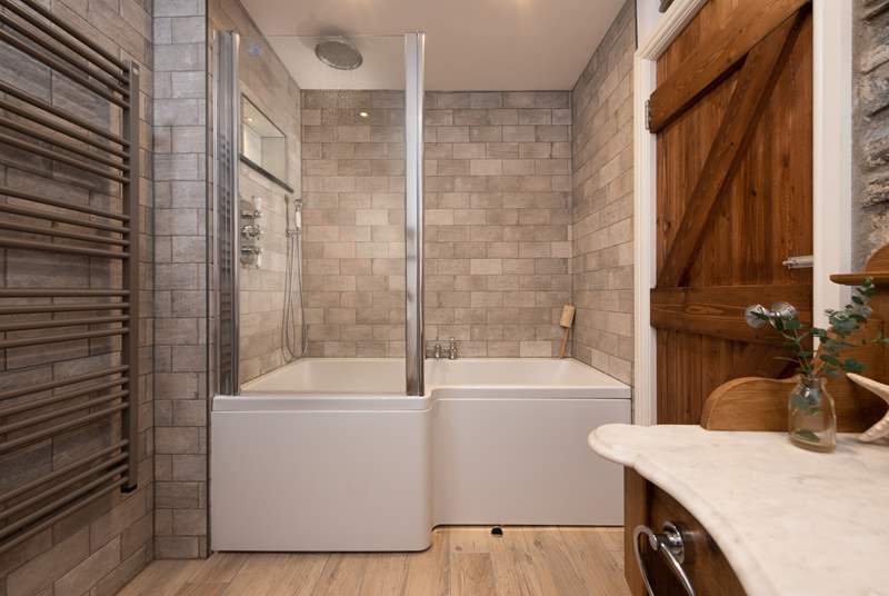 The cottage bathroom is on the ground floor, complete with bath and overhead shower - perfect for long soaks or quick wake-me-up showers in the morning.