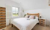 Bedroom 2 is a pretty double bedroom with lovely views over the fields. - Thumbnail Image