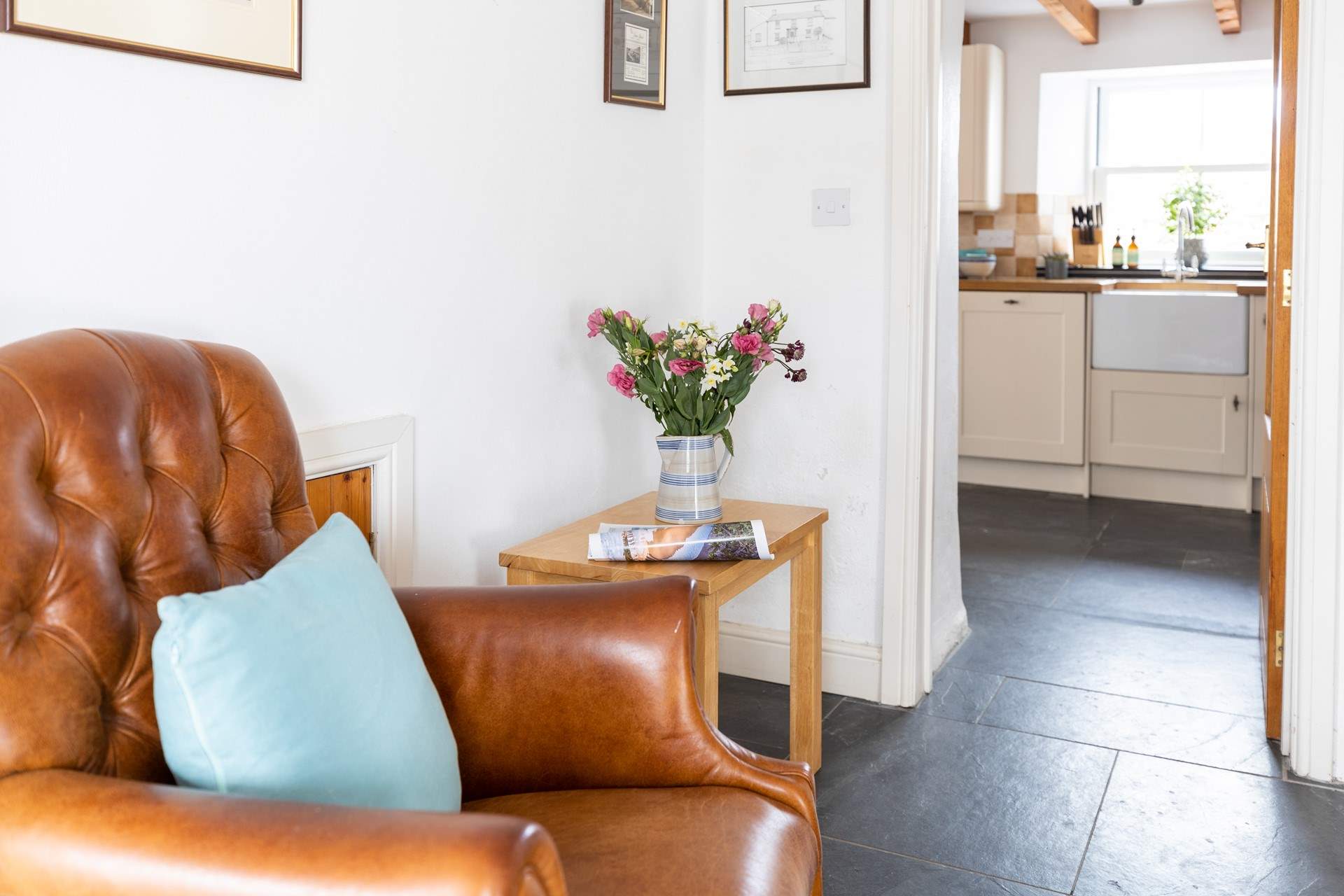 The kitchen leads off the sitting-room.