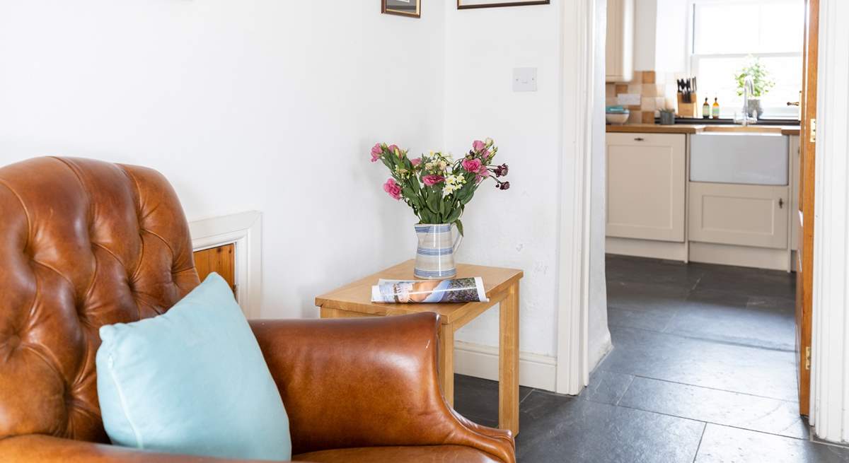 The kitchen leads off the sitting-room.