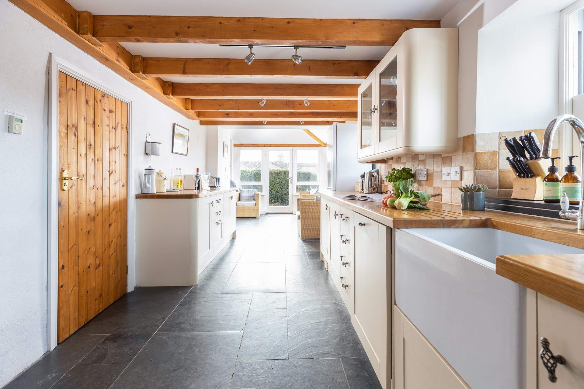 The gorgeous kitchen leads into the dining area.