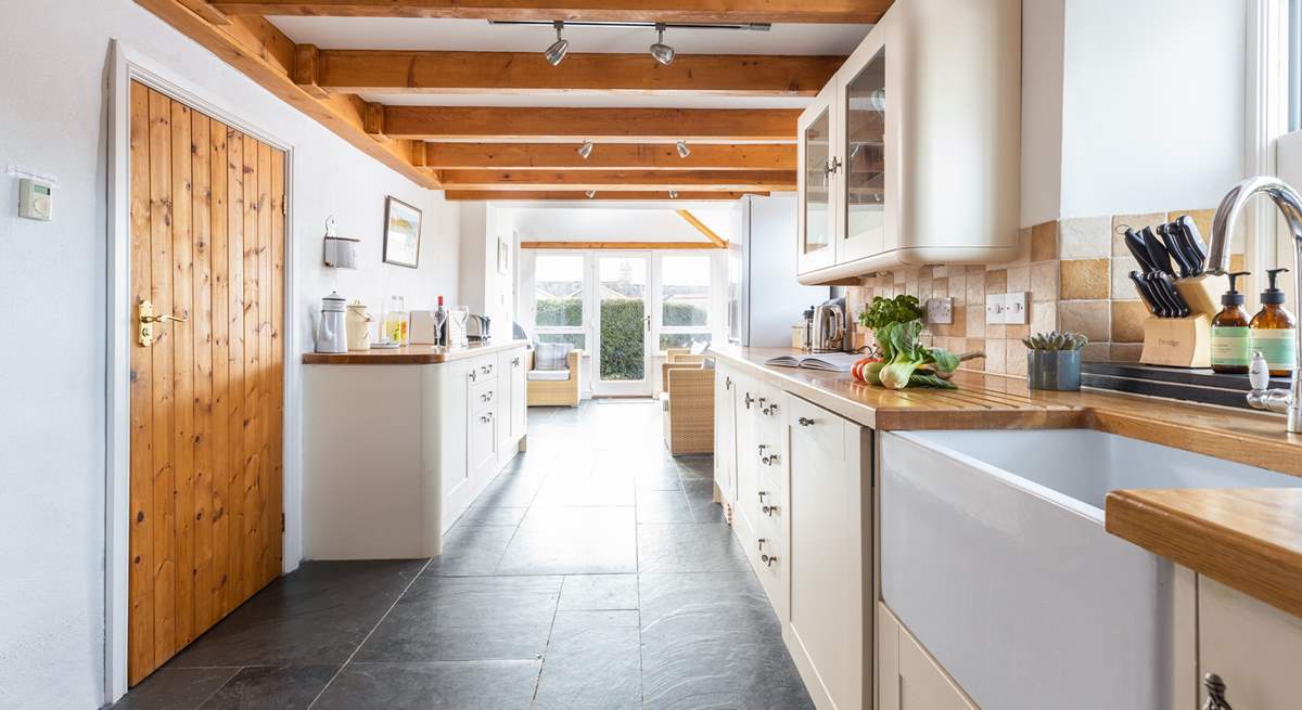 The gorgeous kitchen leads into the dining area.