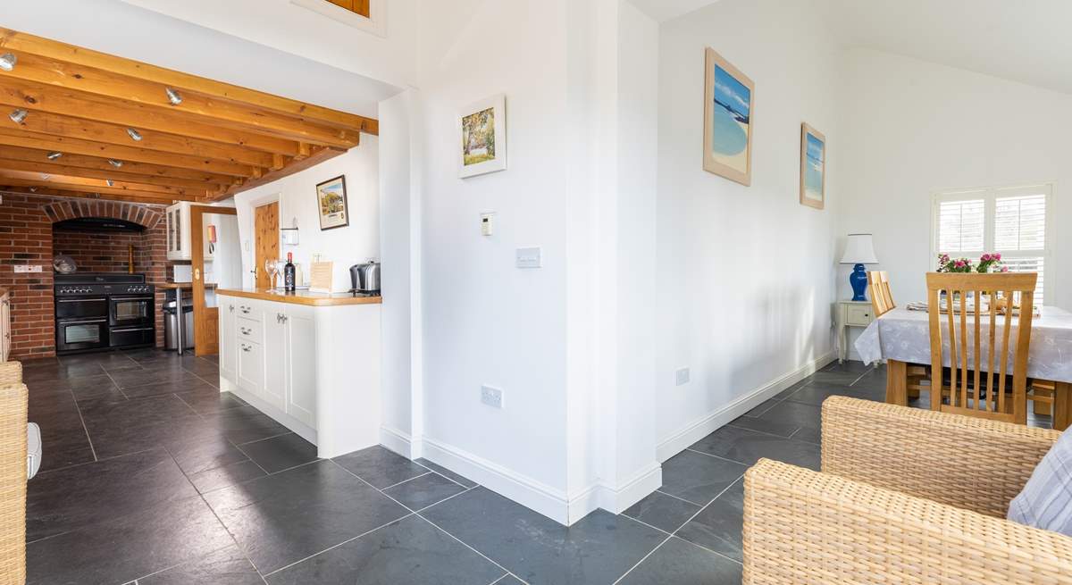 The cleverly designed kitchen leads to the dining area.