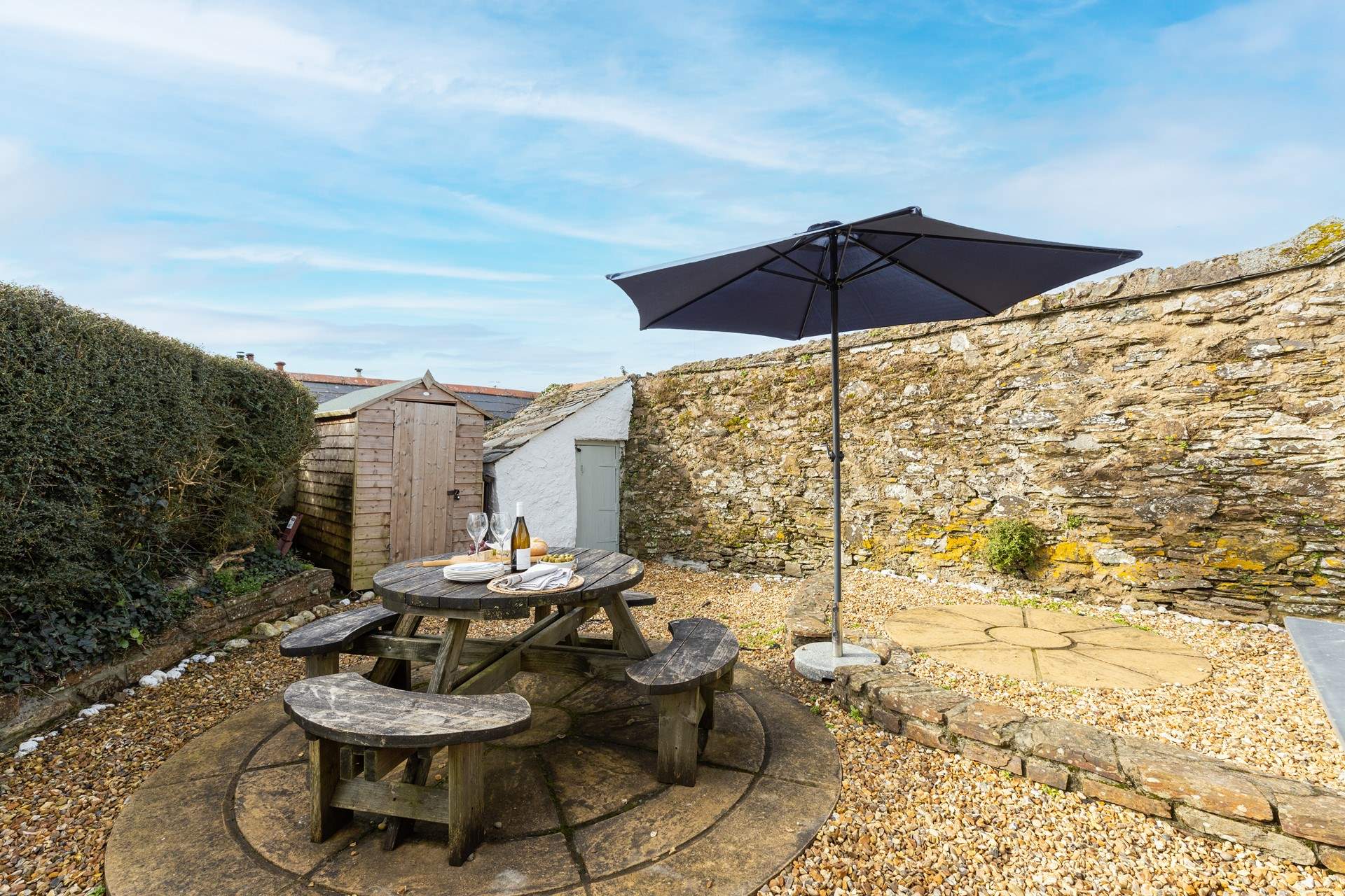 The rear terrace provides the perfect sheltered spot for al fresco dining.