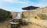 The rear terrace provides the perfect sheltered spot for al fresco dining. - Thumbnail Image