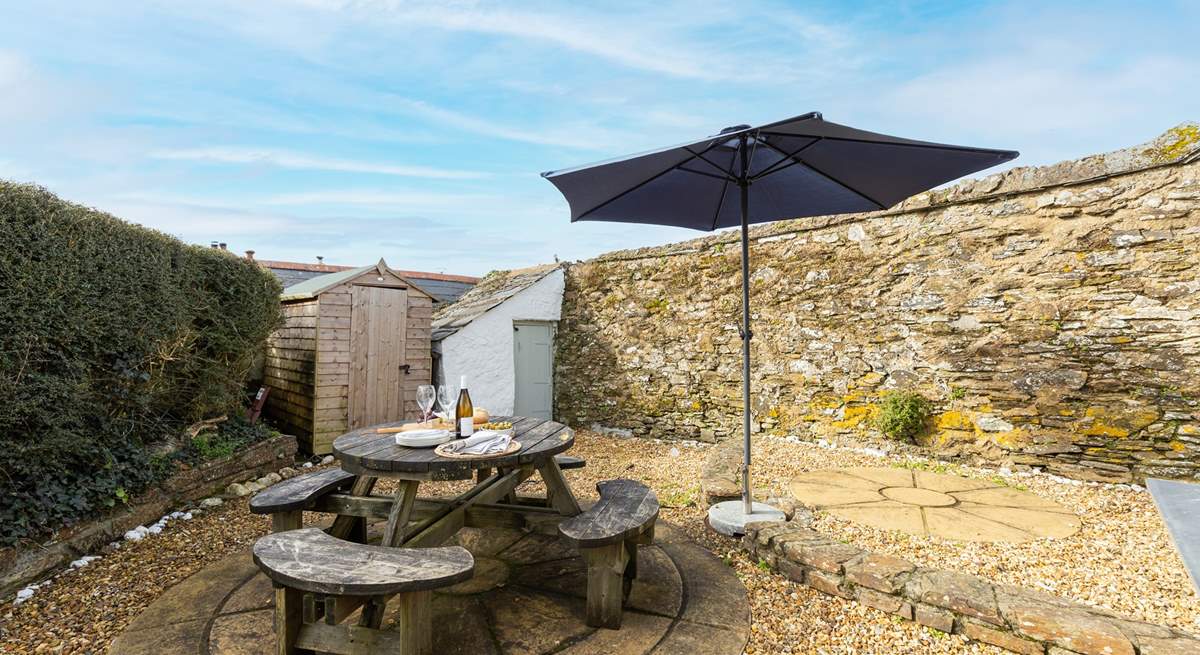 The rear terrace provides the perfect sheltered spot for al fresco dining.