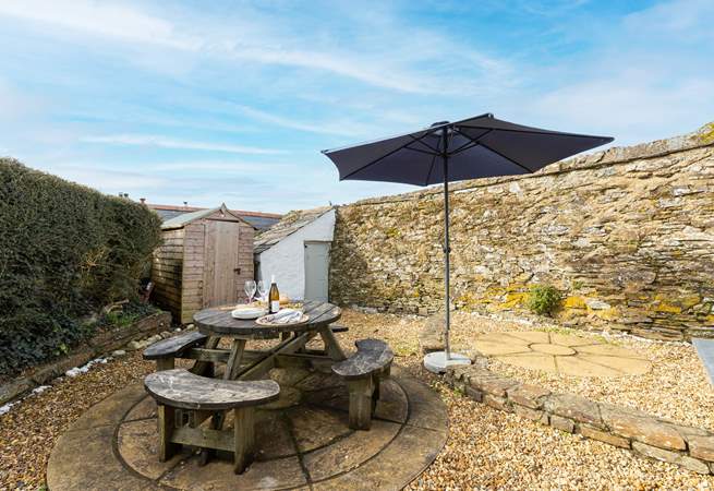 The rear terrace provides the perfect sheltered spot for al fresco dining.