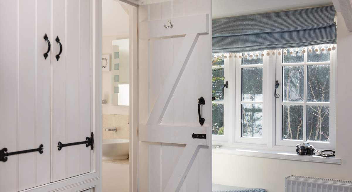 The second bedroom has its own cloakroom with a wash-basin and WC.