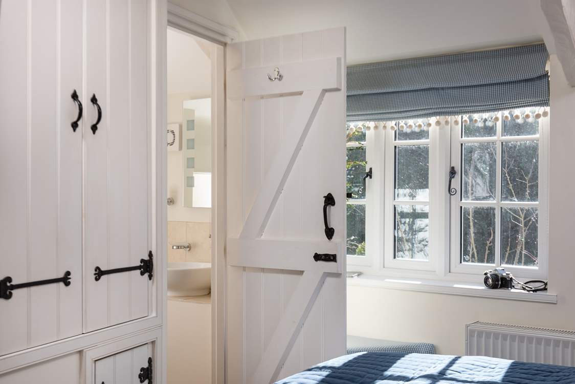 The second bedroom has its own cloakroom with a wash-basin and WC.