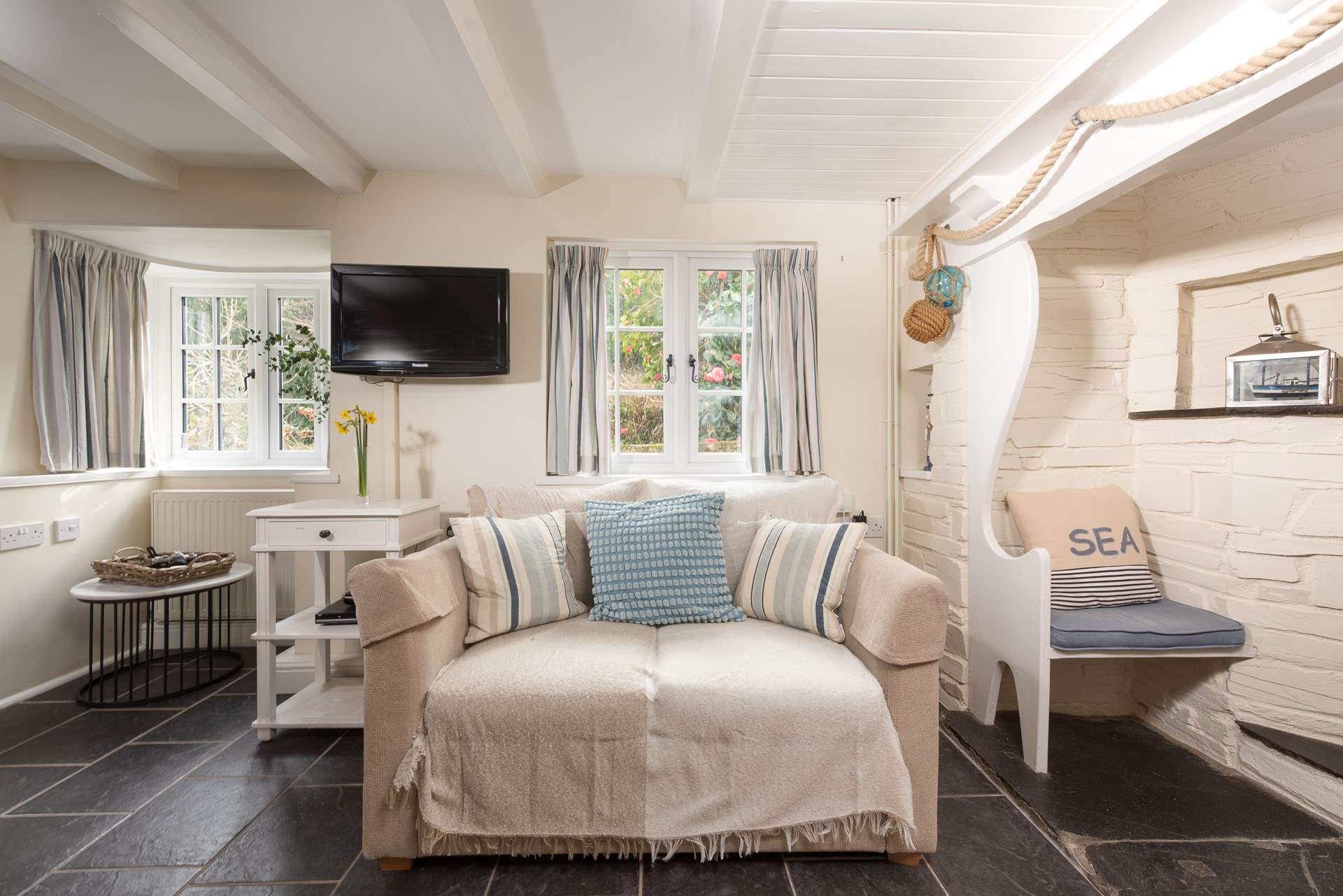 Snuggle up all warm and toasty in front of the open fire or perch inside the inglenook- how sweet is that!