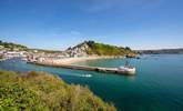 Grab some fish and chips in the town of Looe, best enjoyed sitting on the Banjo Pier that juts out into the sparkling sea. - Thumbnail Image