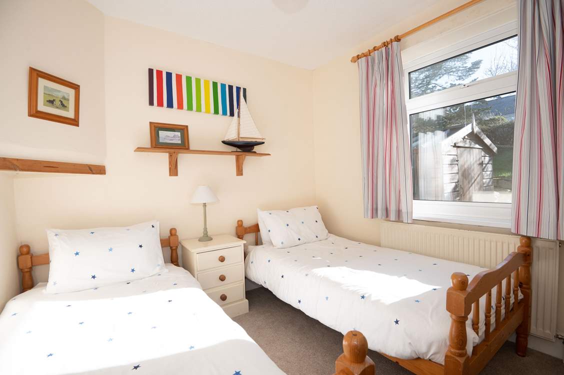 Bringing joy and imagination to bedtime, this twin bedroom is the perfect retreat for young guests.