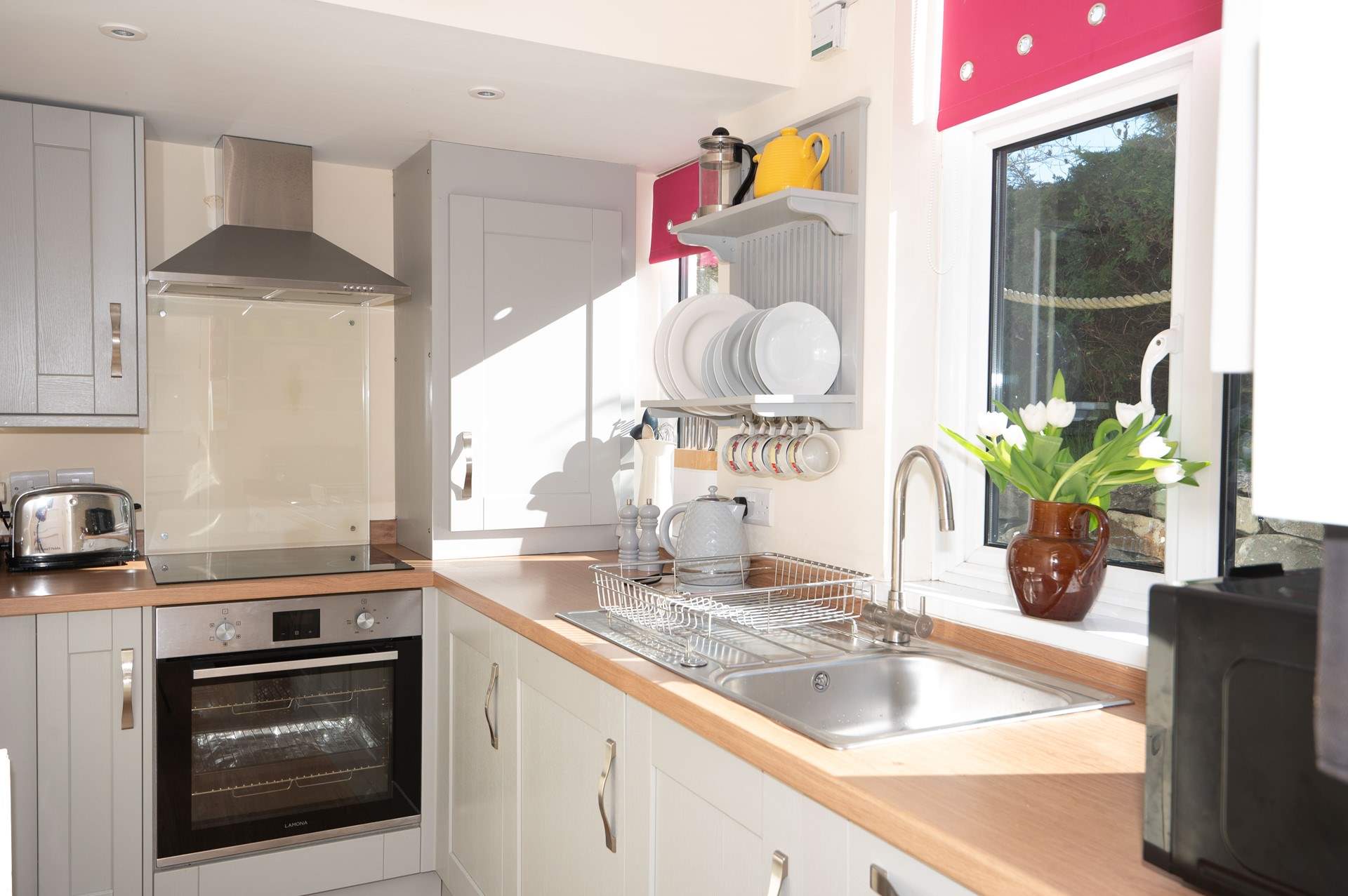 Efficient and stylish, this small galley kitchen packs a punch with its modern appliances and ample storage space.