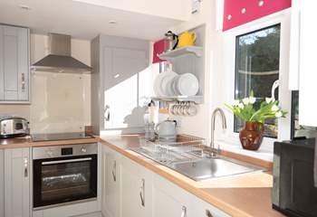 Efficient and stylish, this small galley kitchen packs a punch with its modern appliances and ample storage space.