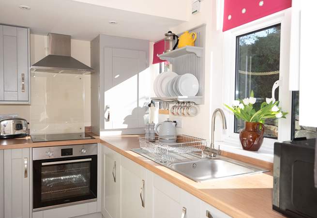 Efficient and stylish, this small galley kitchen packs a punch with its modern appliances and ample storage space.