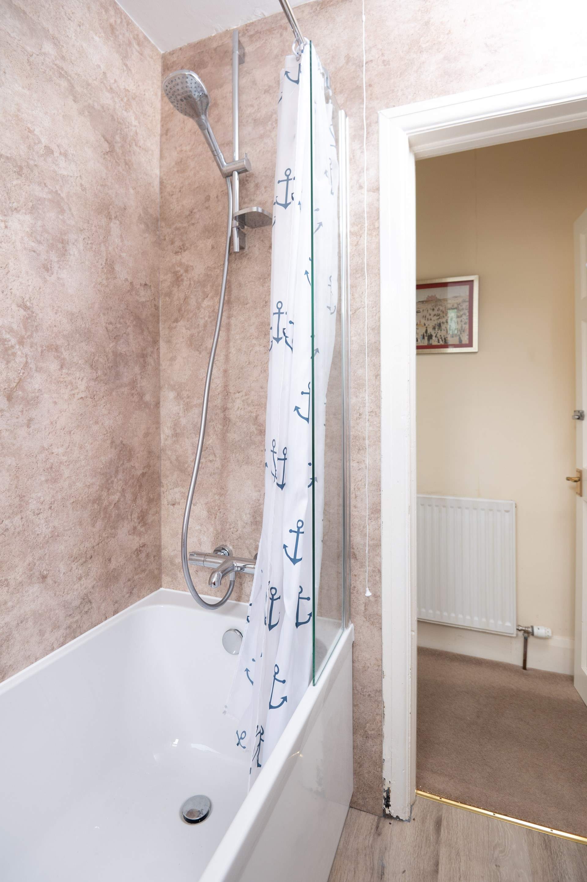 Stylish, recently renovated family bathroom. 