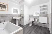 The gorgeous family bathroom on the first floor has a bath and separate shower cubicle.