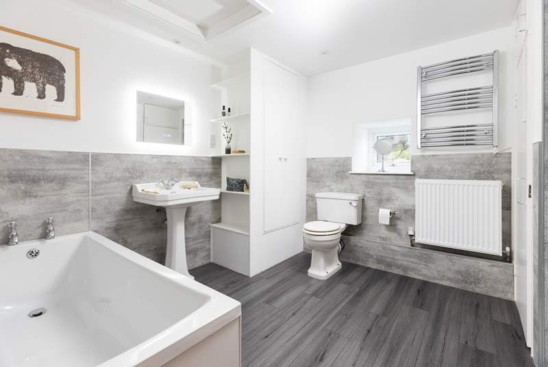 The gorgeous family bathroom on the first floor has a bath and separate shower cubicle. 