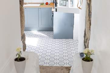 Every little detail has been perfectly co-ordinated here. You will see that three steps lead down from the bedroom to the kitchen.