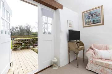 Doors lead from the living area to the deck, the perfect spot for your morning coffee.